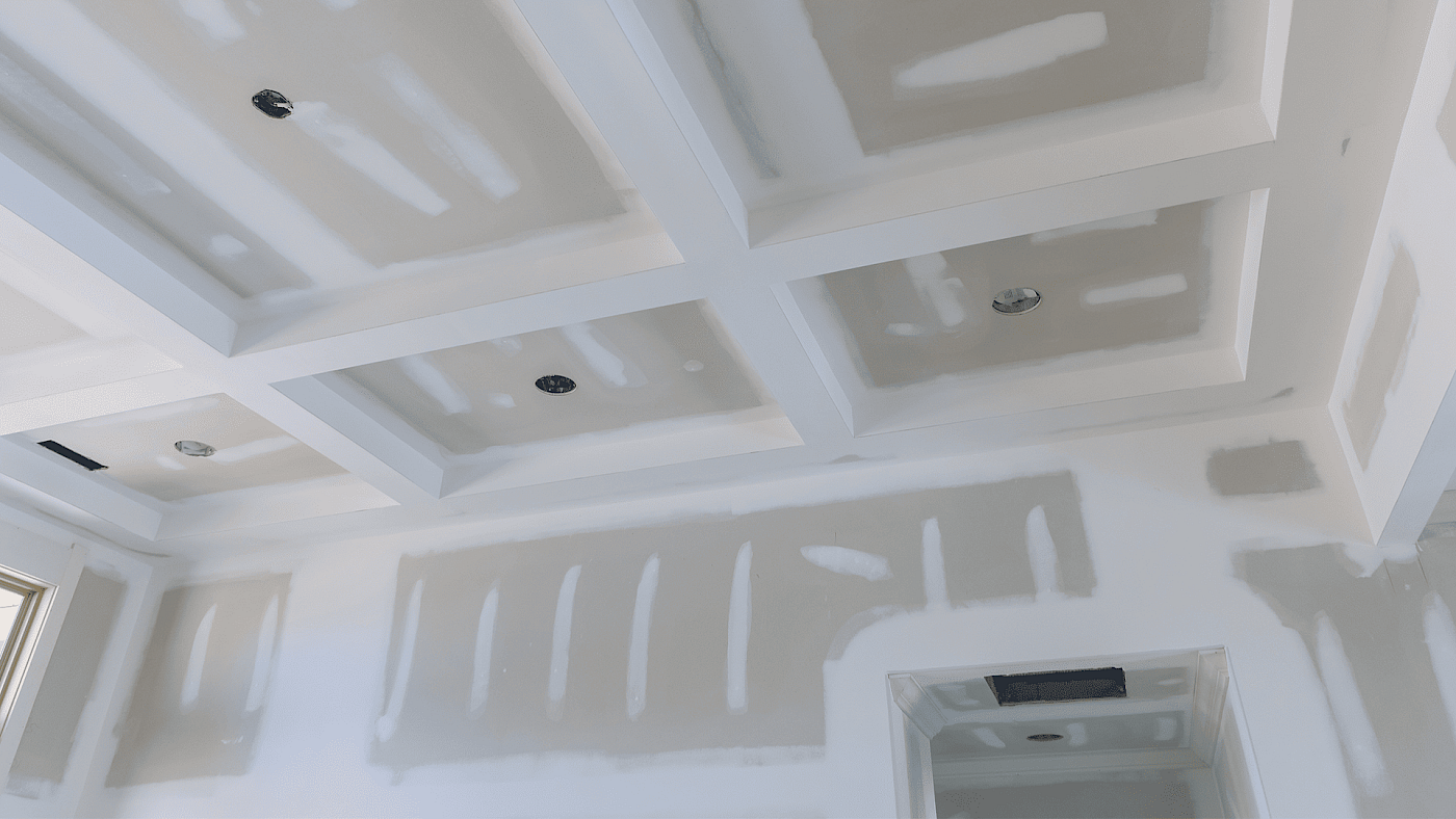 Local plasterer applying plaster to interior wall - request a quote