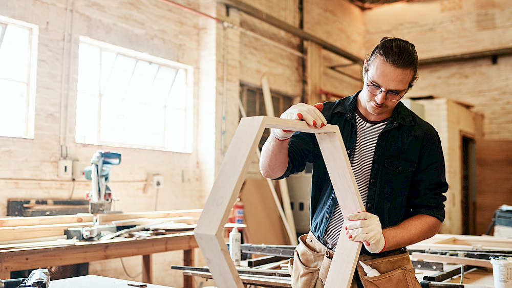 Carpenter building bespoke fitted furniture unit - request a quote